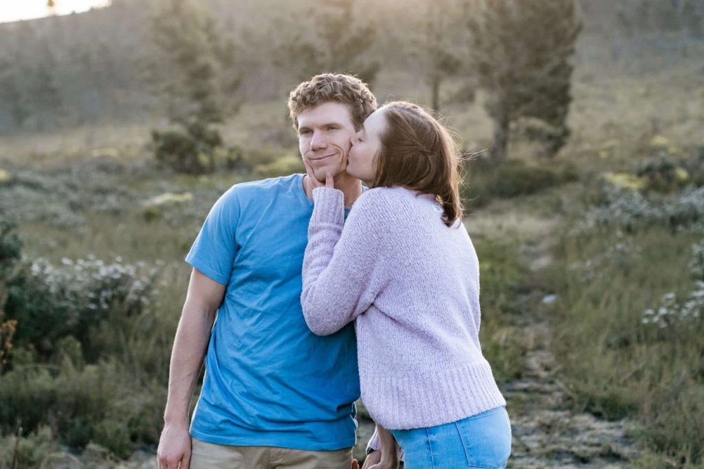 Woman kissing man's cheek